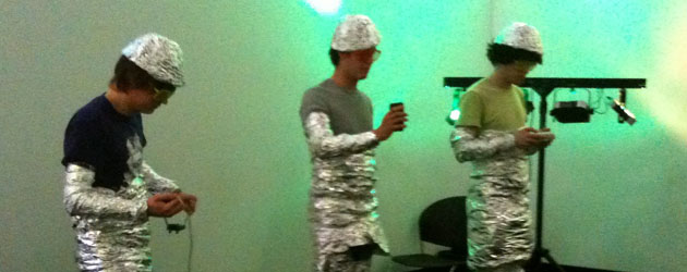 Students in tinfoil outfits performing